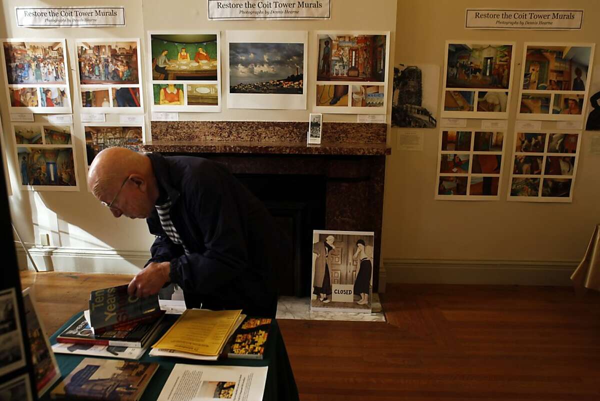 Ralph Bergmann of San Rafael, looks through books at the San Francisco Mint on San Francisco's history, in front of a display for restoration of the Coit Tower murals. Ruth Gottstein, the 89-year old daughter of Coit Tower muralist Bernard Zakheim, promoted the restoration of the murals during the second annual San Francisco History Expo at the Old Mint in San Francisco, Calif., on Sunday, March 4, 2012. Gottstein told stories about the creation of the Coit Tower Murals in 1934, which she witnessed first-hand. Gottstein appears as a 12-year-old girl in Zakheimâ€™s Coit Tower mural "The Library."