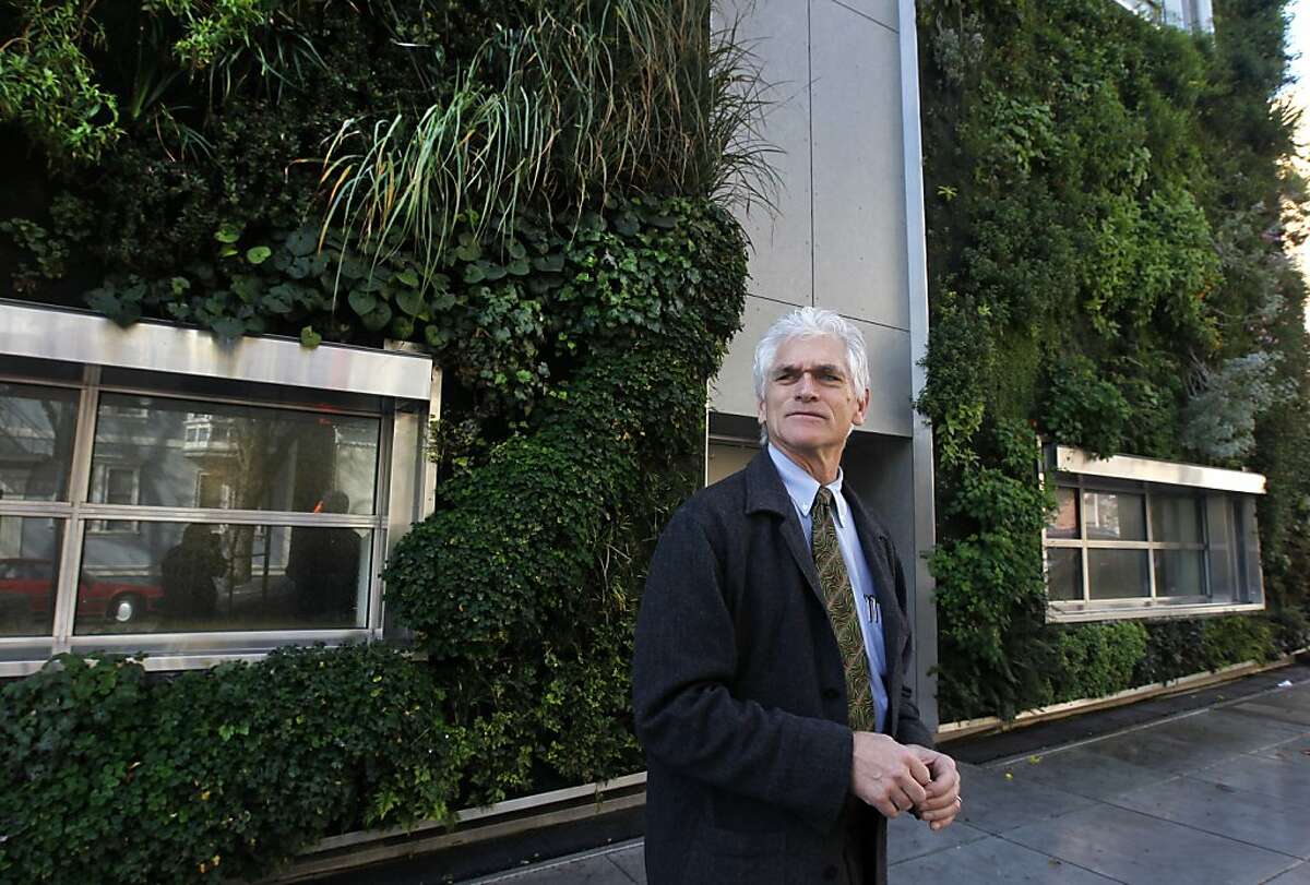 Sam Cuddeback, head of the Drew School, stands with the living wall on the exterior of the new addition to the private college prep school in San Francisco, Calif. on Friday, Feb. 10, 2012. The addition, which nearly doubled the size of the school, opened recently after a long appeals process.
