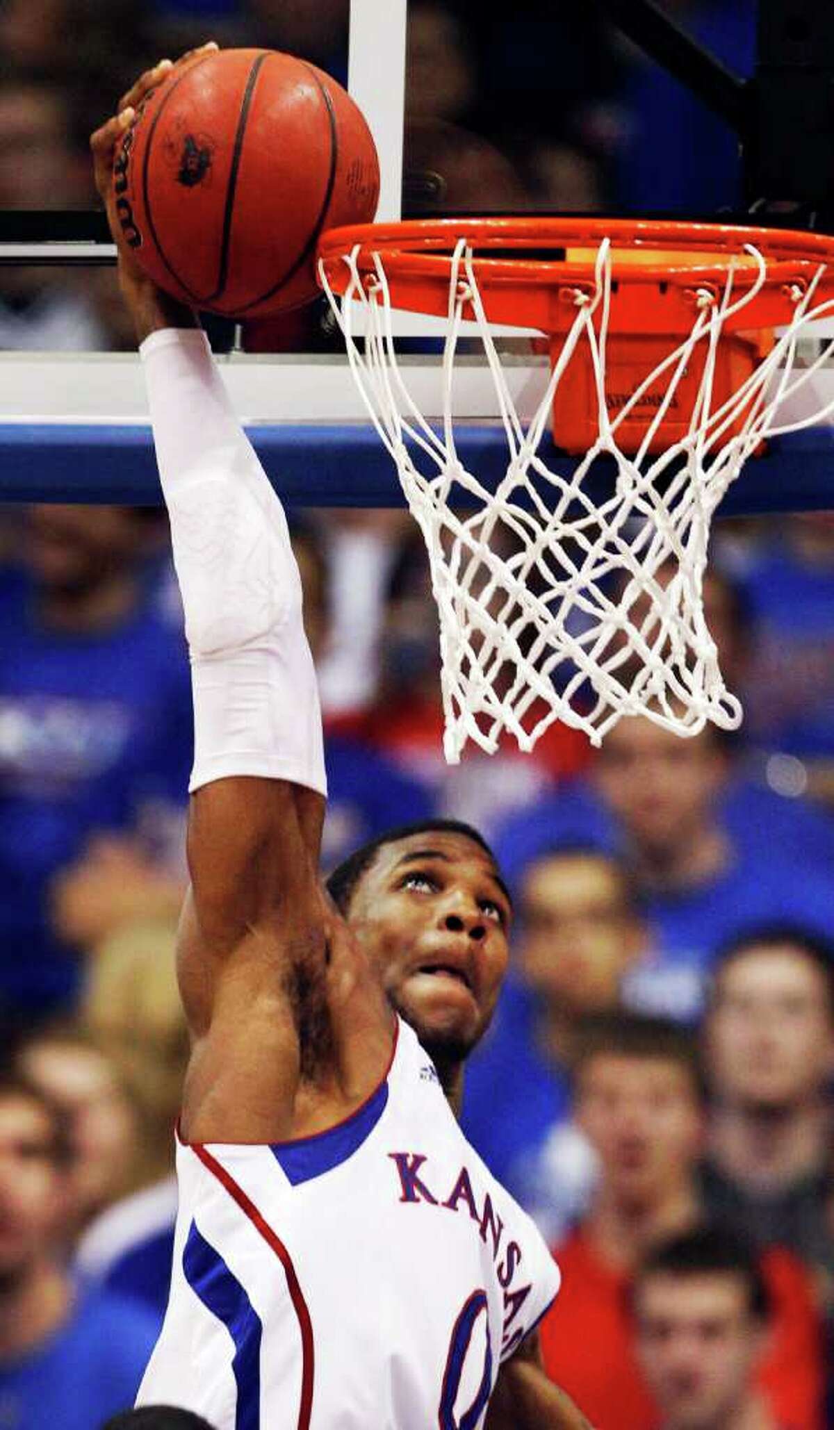 Kansas forward Thomas Robinson (0) attempts a dunk during the second half of an NCAA college basketball game against Texas Tech in Lawrence, Kan., Saturday, Feb. 18, 2012. Robinson contributed 16 points as Kansas won 83-50.