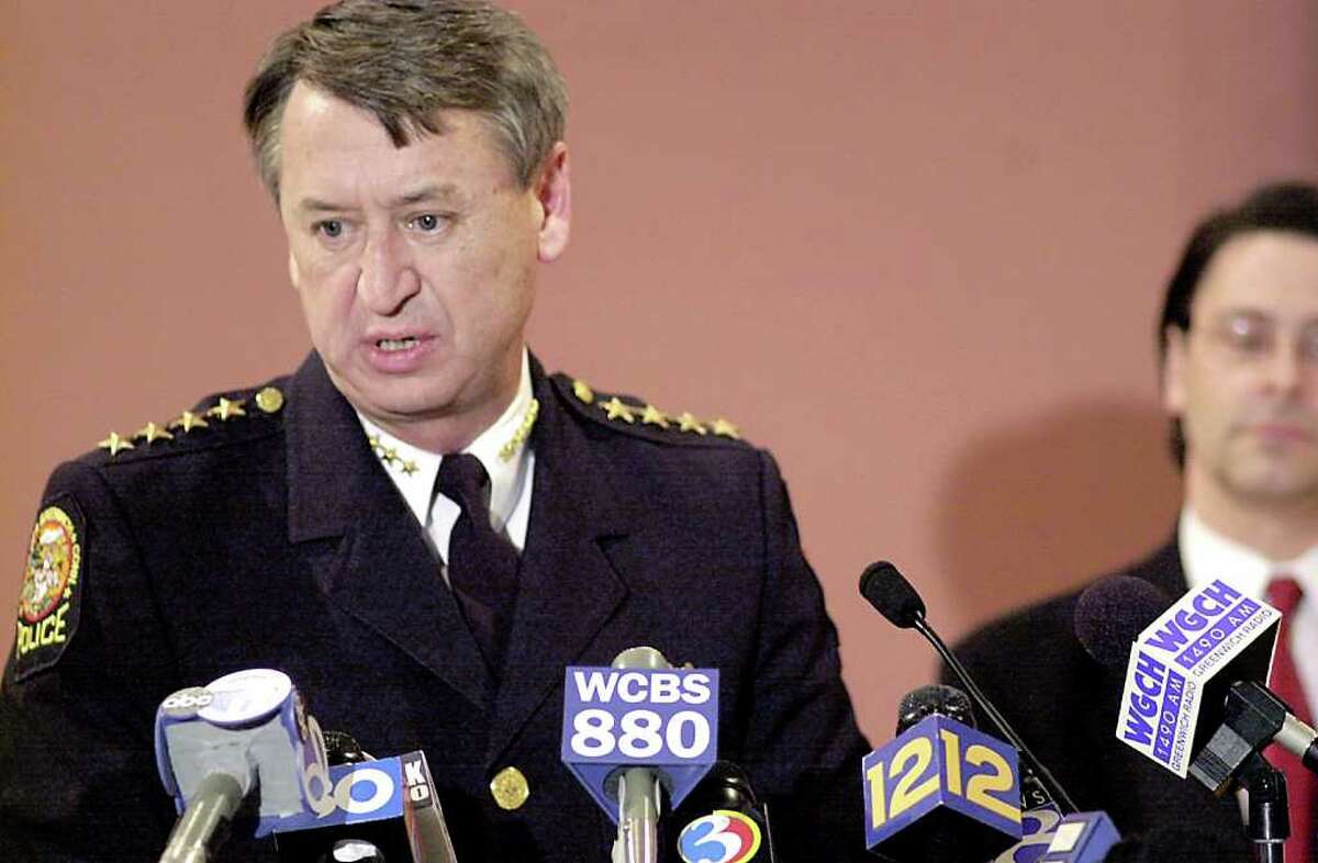 In this March 8, 2001, file photo, Greenwich Police Chief Peter Robbins speaks to the press at a Matthew Margolies press conference held at Cole Auditorium of Greenwich Library. Deputy Chief State's Attorney Christopher Morano is in the background.