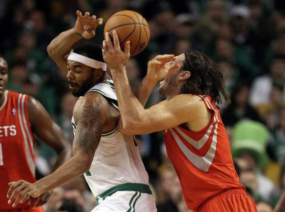 Luis Scola reacts as he and Chris Wilcox of the Boston Celtics collide on March 6, 2012 at TD Garden in Boston.