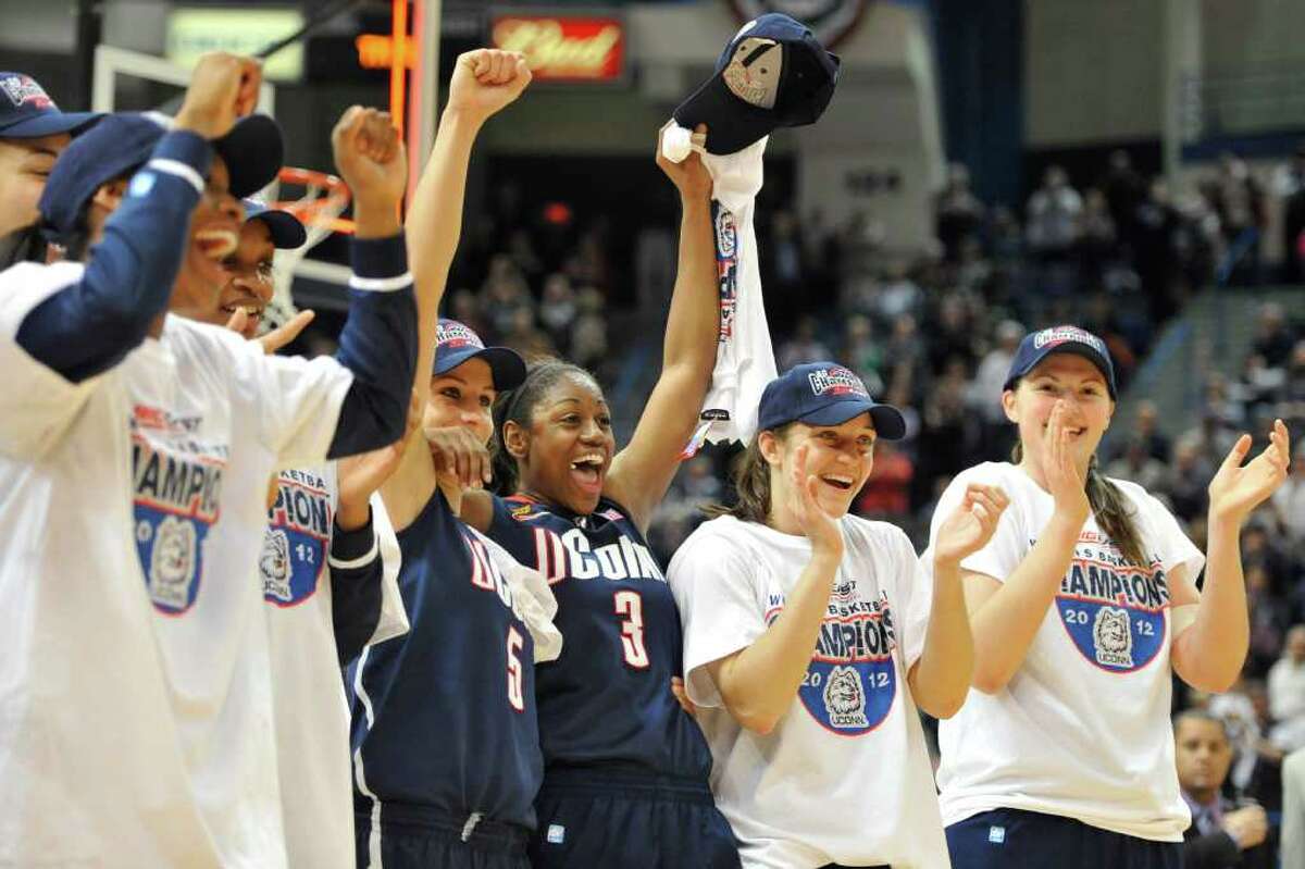 Connecticut players celebrate a 63-54 win over Notre Dame in an NCAA college basketball game in the final of the Big East women's tournament in Hartford, Conn., Tuesday, March 6, 2012. (AP Photo/Jessica Hill)