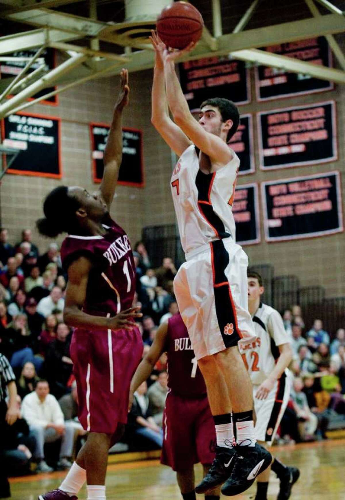 Ridgefield High School's John Heller takes a shot against Bulkeley High School in a game played at Ridgefield. Tuesday, Mar. 6, 2012