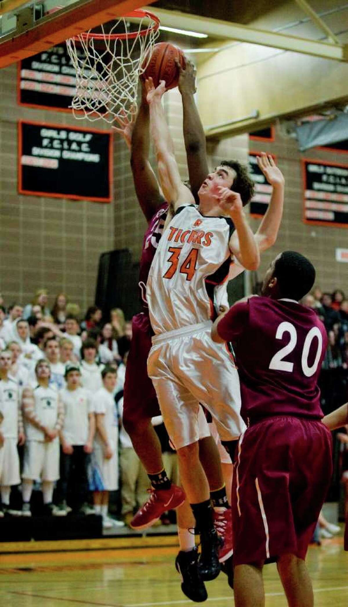 Ridgefield High School's Seth von Kuhn goes up for a shot against Bulkeley High School in a game played at Ridgefield. Tuesday, Mar. 6, 2012