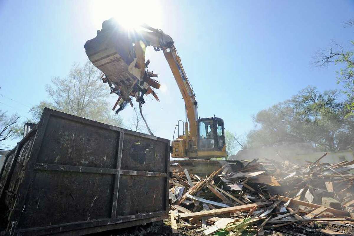 Residents hope demolition of vacant homes will run out the 'devil'