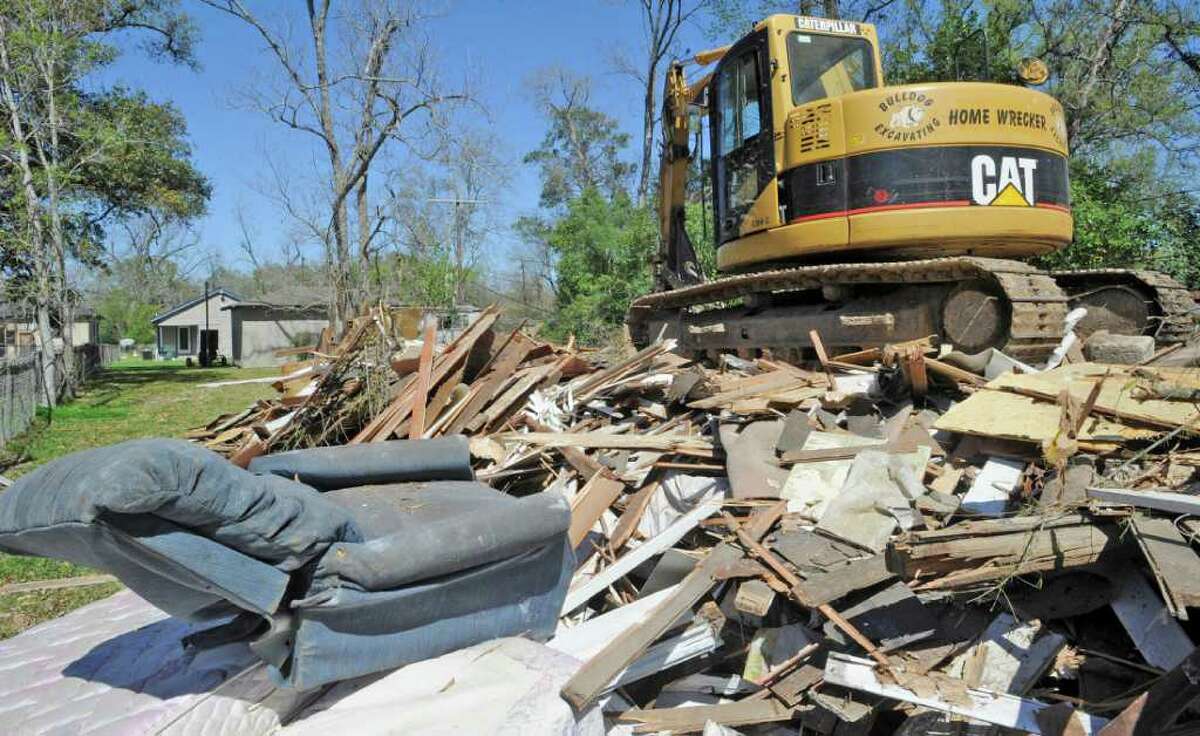 Residents hope demolition of vacant homes will run out the 'devil'