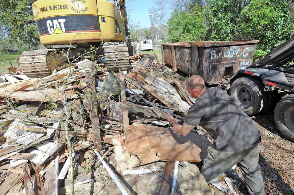 Residents hope demolition of vacant homes will run out the 'devil'