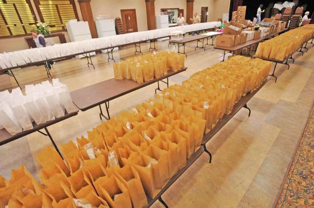 The Sisterhood of Temple Emanuel was preparing for their annual Deli Day lunch Tuesday morning. They have hundreds of lunch bags set up in the auditorium and were making up trays of turkey and cornbeef in the kitchen that were being made in advance for the Wednesday delivery. Dave Ryan/The Enterprise