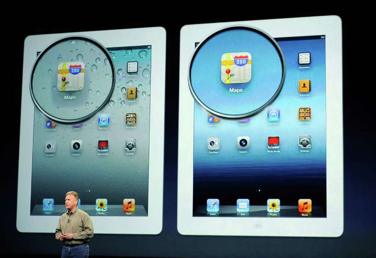 Apple Senior VP of Worldwide Marketing Phil Schiller talks about the display on the new iPad during an Apple product launch event at Yerba Buena Center for the Arts on March 7, 2012 in San Francisco, California. In the first product release following the death of Steve Jobs, Apple Inc. introduced the third version of the iPad and an updated Apple TV.