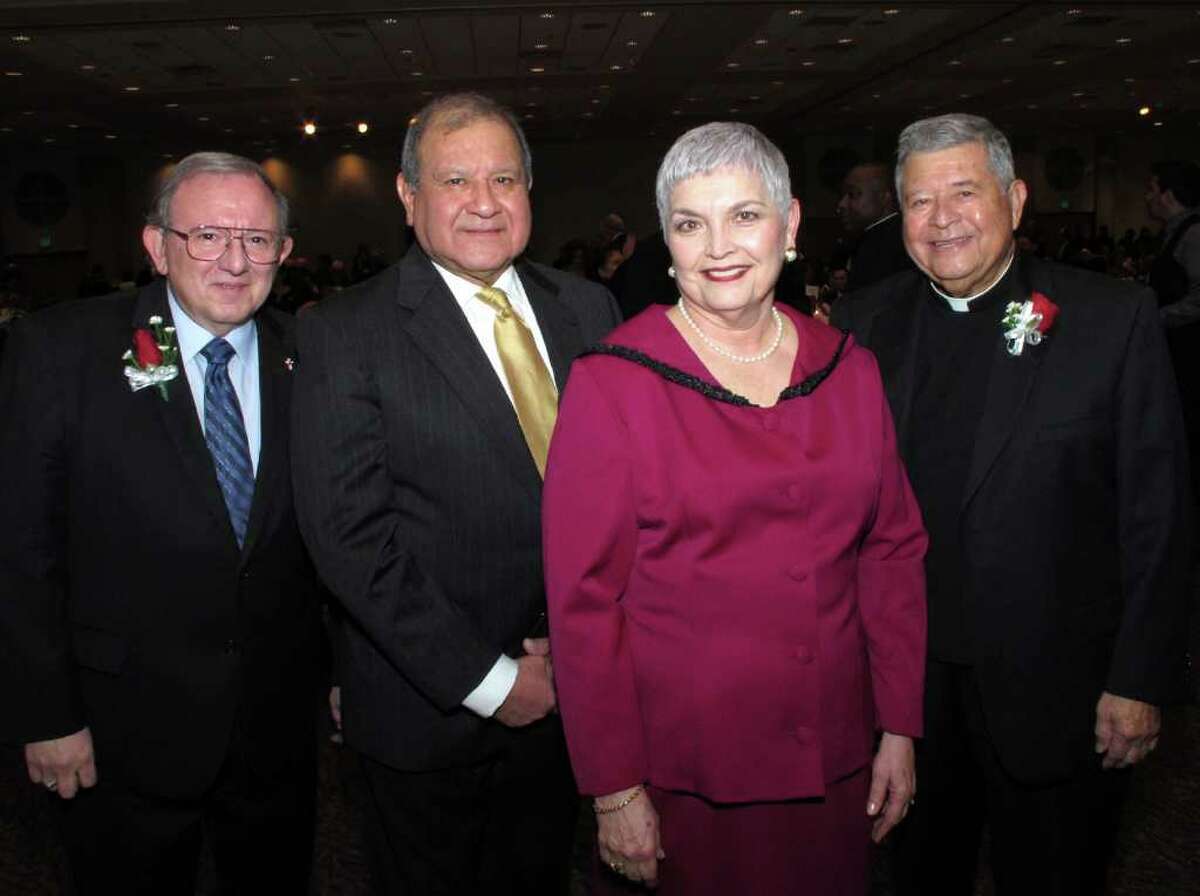 OTS/HEIDBRINK - Event emcee Pat Rodgers, from left, co chairs and spouses Ruben Escobedo and Veronica Salazar-Escobedo and honoree Father Albert Vasquez gather at the Mexican American Catholic College 40th anniversary gala at the University of the Incarnate Word on 2/28/2012. This is #2 of 2 photos. names checked photo by leland a. outz