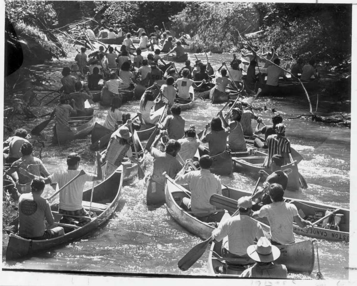 Chronicle file photo by Othell O. Owensby Jr., Chronicle staff SHOT ON APRIL 22, 1972. CANOE RACE DOWN BUFFALO BAYOU. REEKING REGATTA. HOUCHRON CAPTION (06/06/1999): The race is on as dozens of canoers battle one another and the bayou in one of the first ``Reeking Regatta'' events in 1971. The bayou was more polluted back then, and the race has since been renamed the ``anything-that-floats'' event.