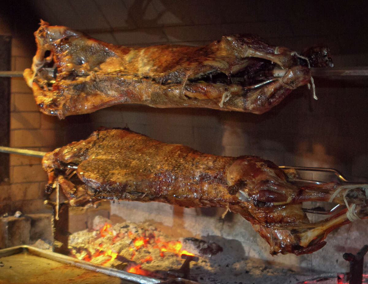Lamb roasts on the giant rotisserie in the front dining room at Kokkari.