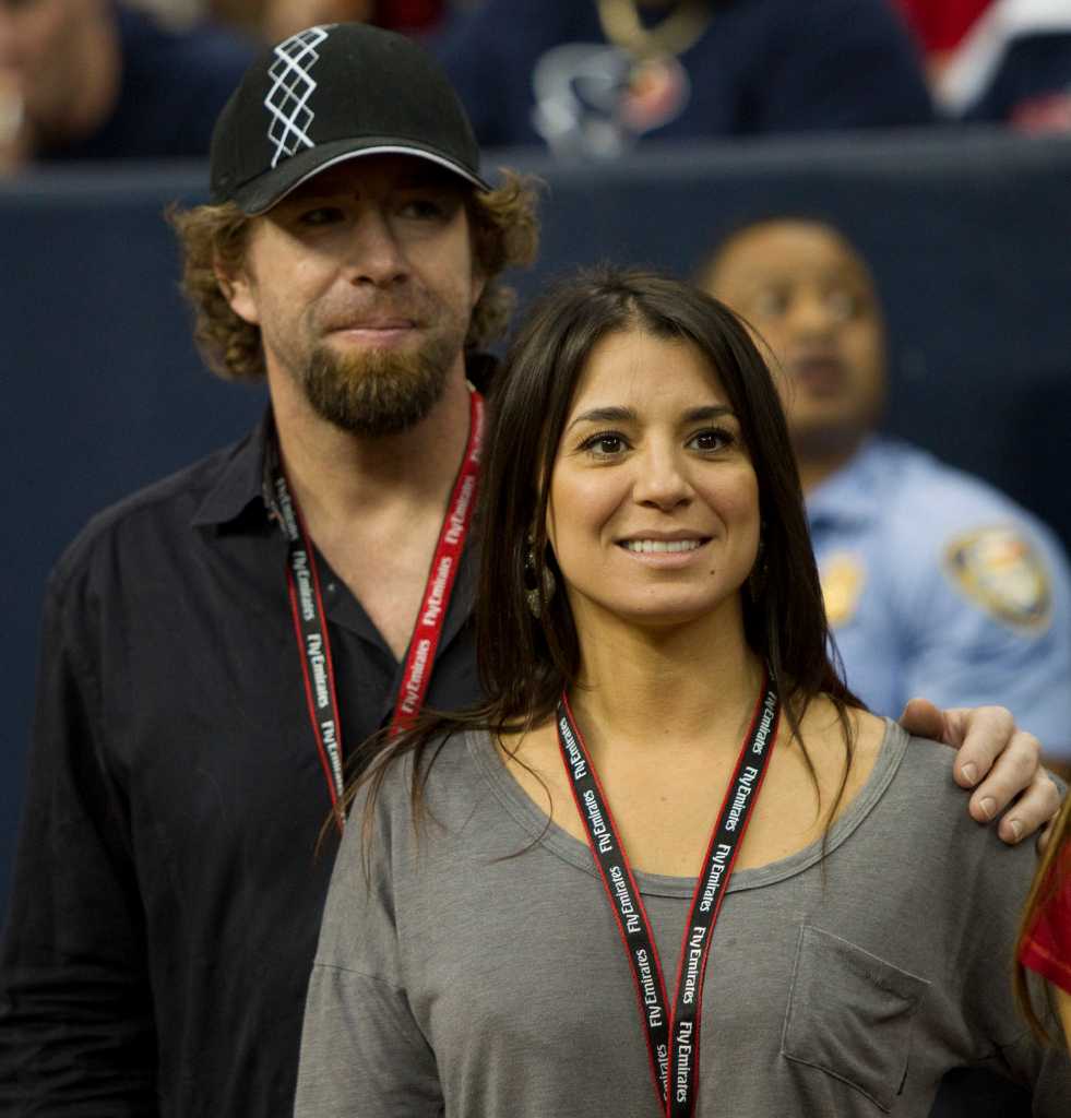 Former Houston Astros' Jeff Bagwell, left, and his girlfriend Rachel Brown,  right, in the second quarter of an NFL football game between the Houston  Texans and Atlanta Falcons Sunday, Dec. 4, 2011