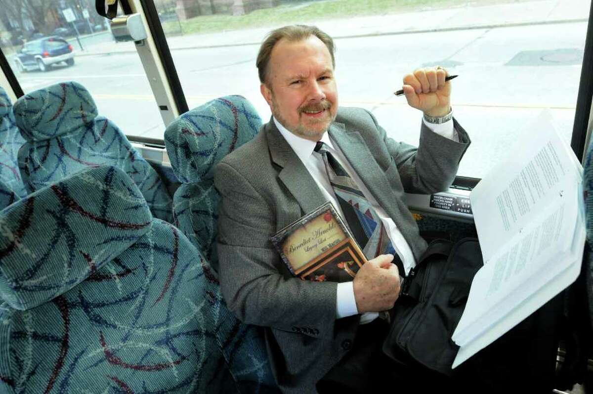 Will Martin of Saratoga Springs sits on the CTDA bus, where he wrote a novel "Benedict Arnold: Legacy Lost" during his commuting time, on Friday, March 9, 2012, in Albany, N.Y. (Cindy Schultz / Times Union)