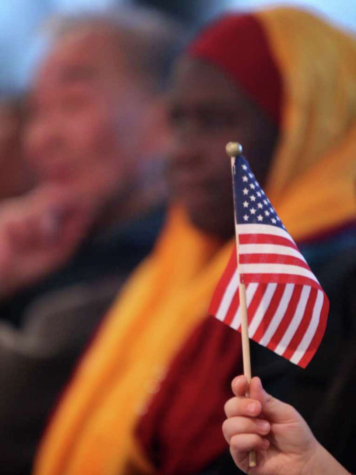 Taking on a new citizenship is one of the most solemn decisions a person can make. Take a look at scenes from Seattle citizenship ceremonies.