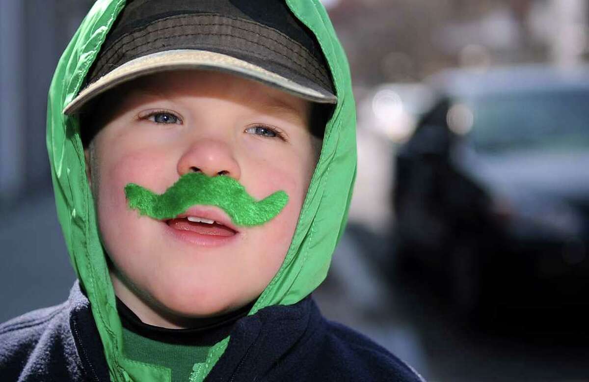 Joshua Lowry, 3, of Southbury, dons a green mustache for Saturday's Saint Patrick's Day parade in Stamford on March 10, 2012.