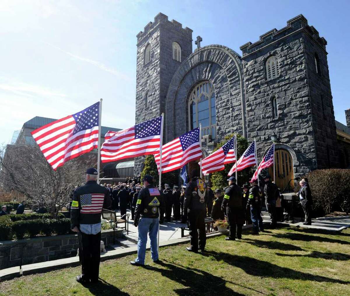 The Patriot Guard Riders of the Connecticut Chapter fly the colors during the burial Mass for retired Greenwich Police Chief Peter J. Robbins at St. Mary's Parish in Greenwich, Saturday, March 10, 2012.