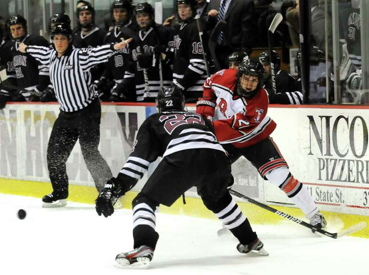RPI's Mark McGowan (21), right, shoots the puck as Union's Mat Bodie (22) defends during Game 2 of the ECAC hockey quarterfinals on Saturday, March 10, 2012, at Union College in Schenectady, N.Y. (Cindy Schultz / Times Union)