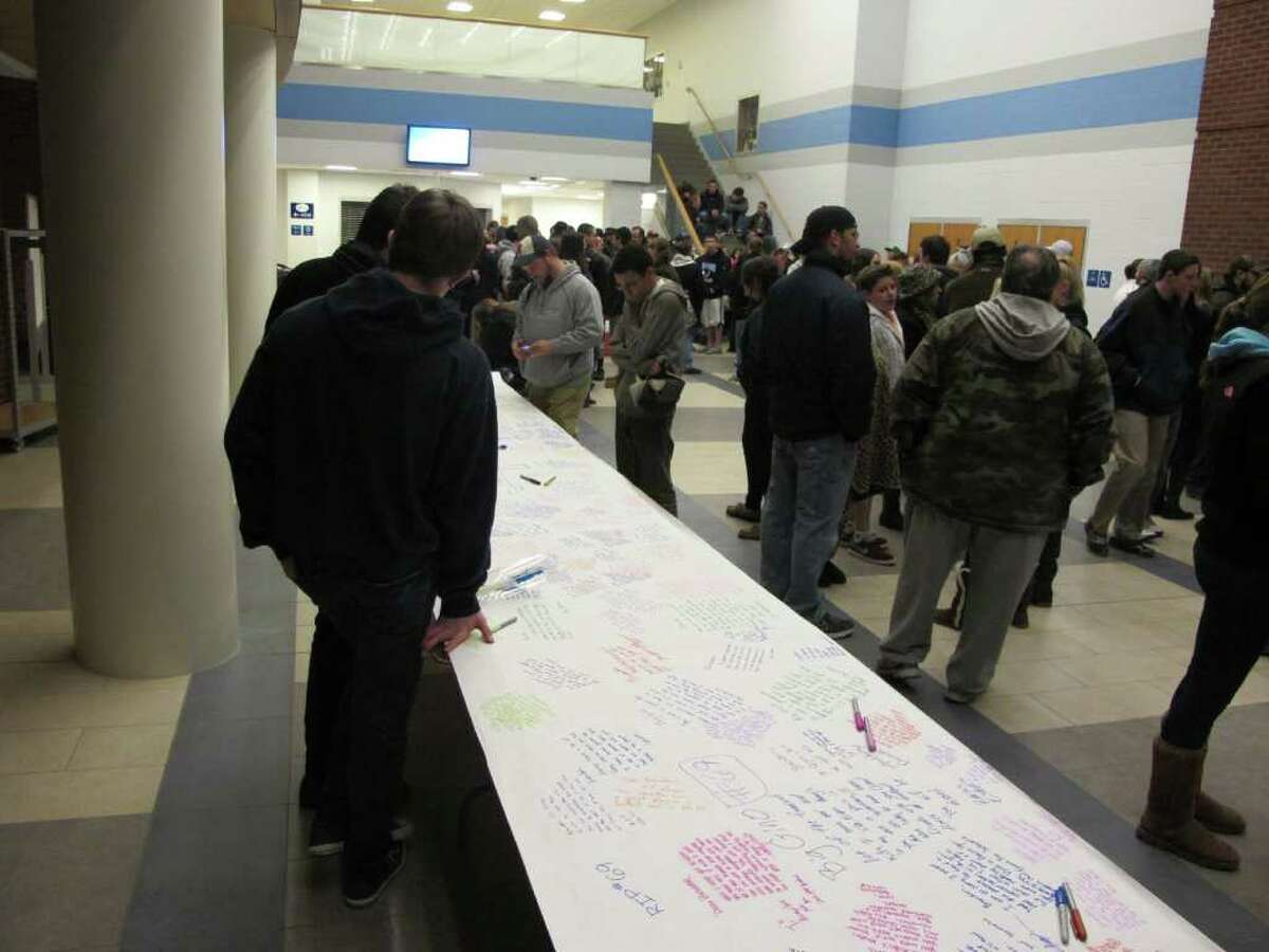 Hundreds of students, along with parents and teachers staged an all-day vigil Saturday at Oxford High School for Brandon Giordano, who was killed in a crash late Friday night. In the lobby, students expressed their sorrow by writing on a 36-foot table covered with a long roll of paper. On Monday, grief counselors will be on hand to meet with students.