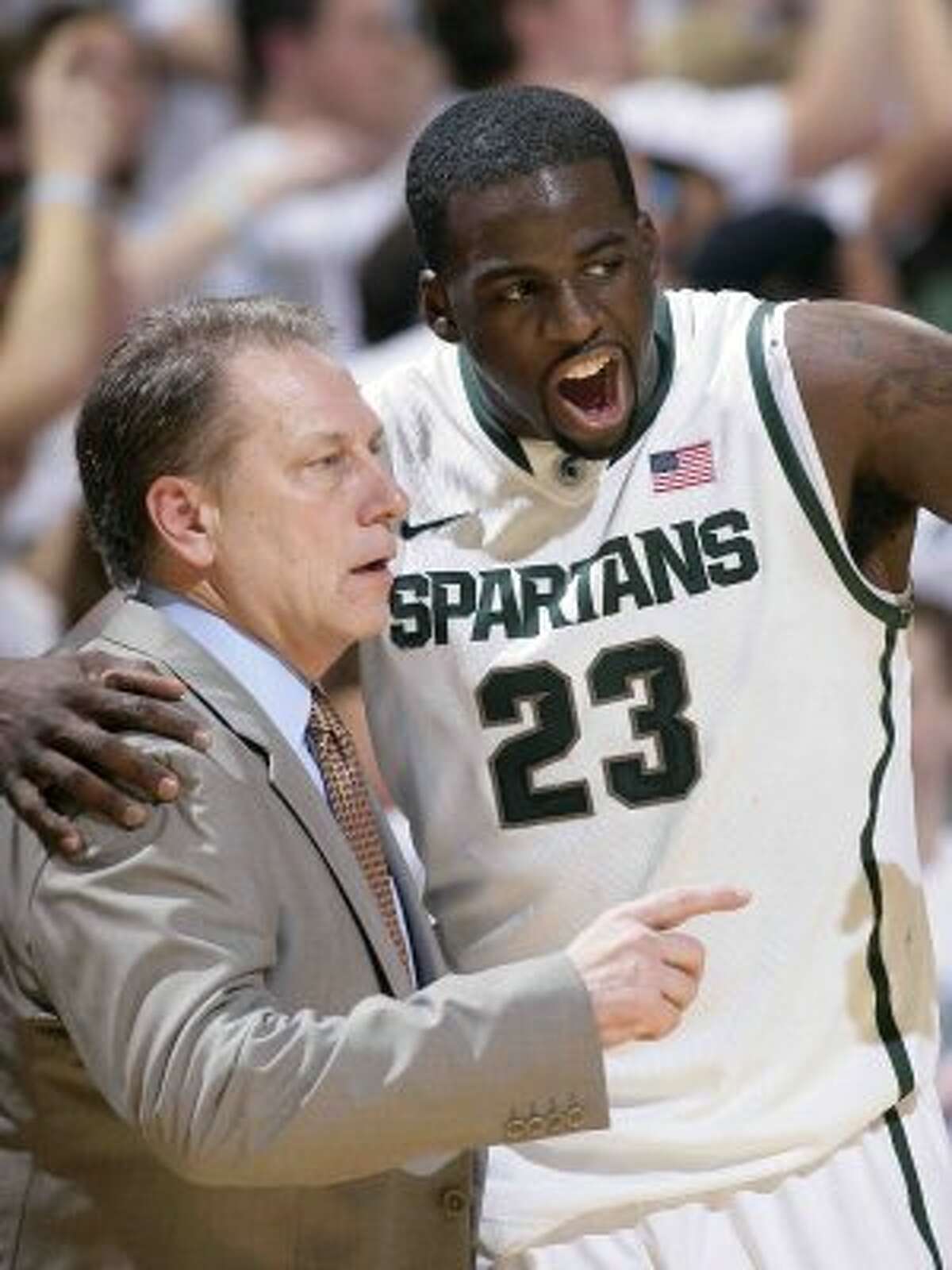 Draymond Green, in his Michigan State days, with coach Tom Izzo. (Al Goldis / Associated Press)