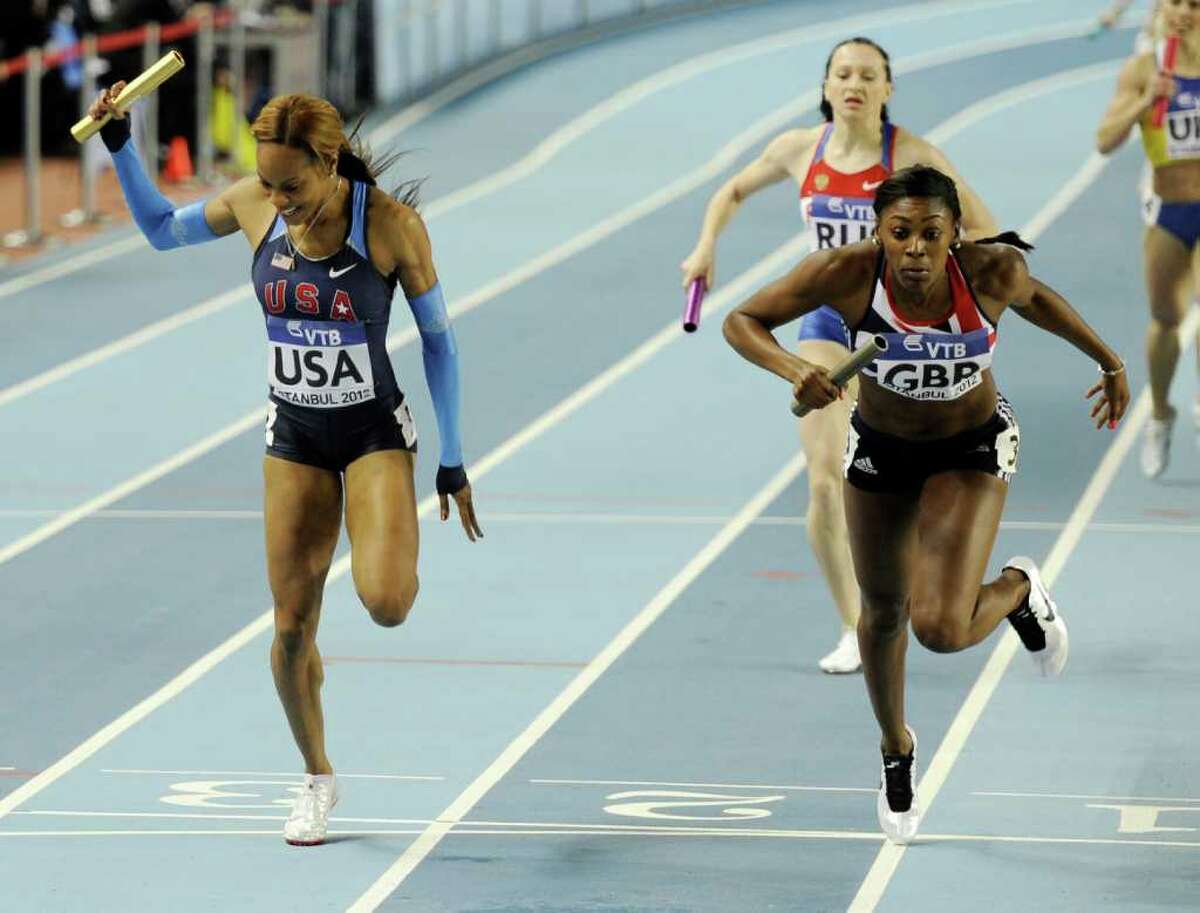 Britain's Perri Shakes-Drayton, right, crosses the finish line ahead of United States' Sanya Richards-Ross to winning the gold medal in the Women's 4x400m relay during the World Indoor Athletics Championships in Istanbul, Turkey, Sunday, March 11, 2012.