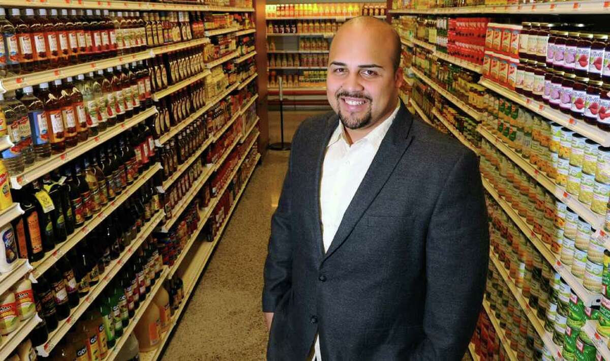 Anthony Pena poses for a photo in City Supermarket on East Main St. in Stamford on Tuesday, March 13, 2012.