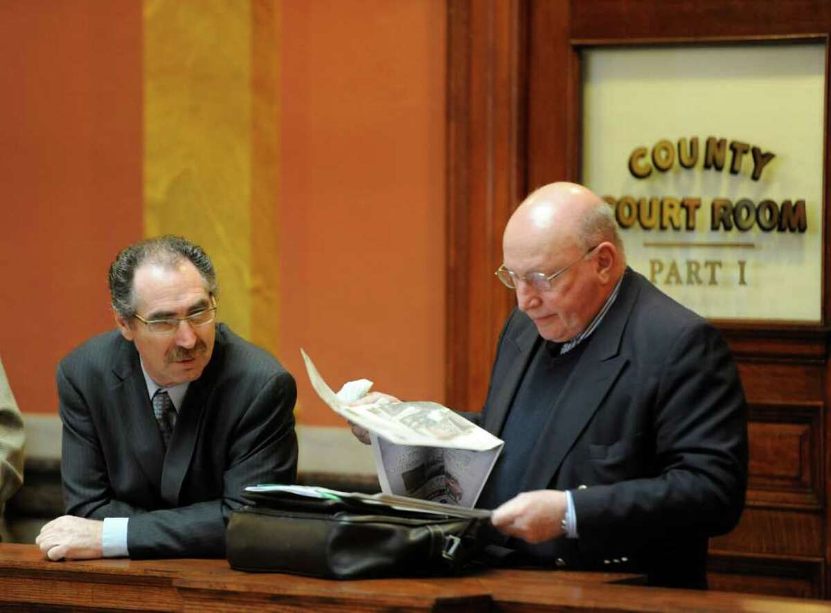 Michael LoPorto joined by his attorney Michael Feit, wait outside Judge George Pulver?s courtroom in Troy, N.Y. March 13, 2012. Judge Pulver declared a mistrial in ballot fraud case which LoPorto and Edward McDonough are defendants. (Skip Dickstein / Times Union)