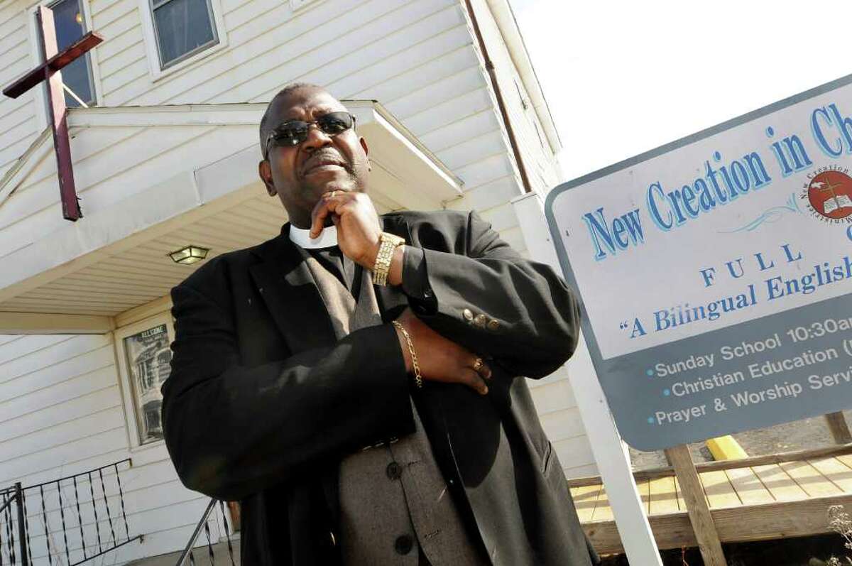 Rev. Eloy Binnon talks about his church facing foreclosure on Tuesday, March 13, 2012, at New Creation in Christ Ministries in Schenectady, N.Y. The city sold the liens to a collection agency, even though the church is a nonprofit and isn't required pay taxes. (Cindy Schultz / Times Union)