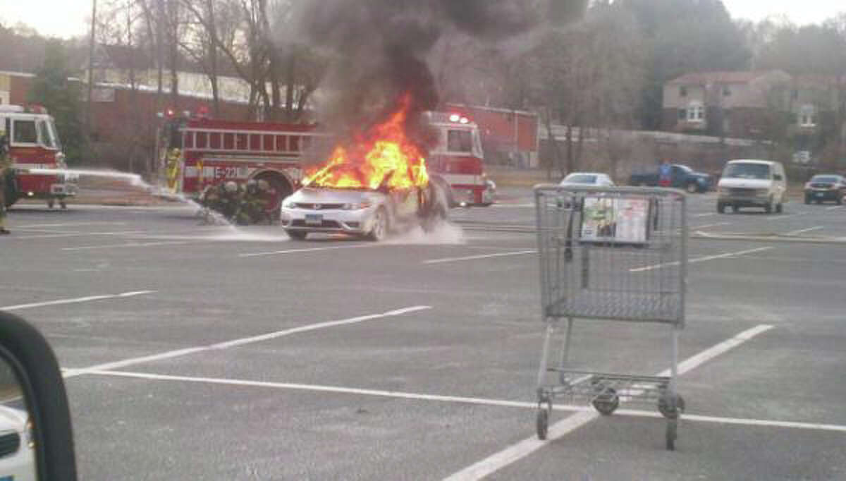 Firefighters responded to a car fire in a North Street parking lot on Tuesday, March 14, 2012.