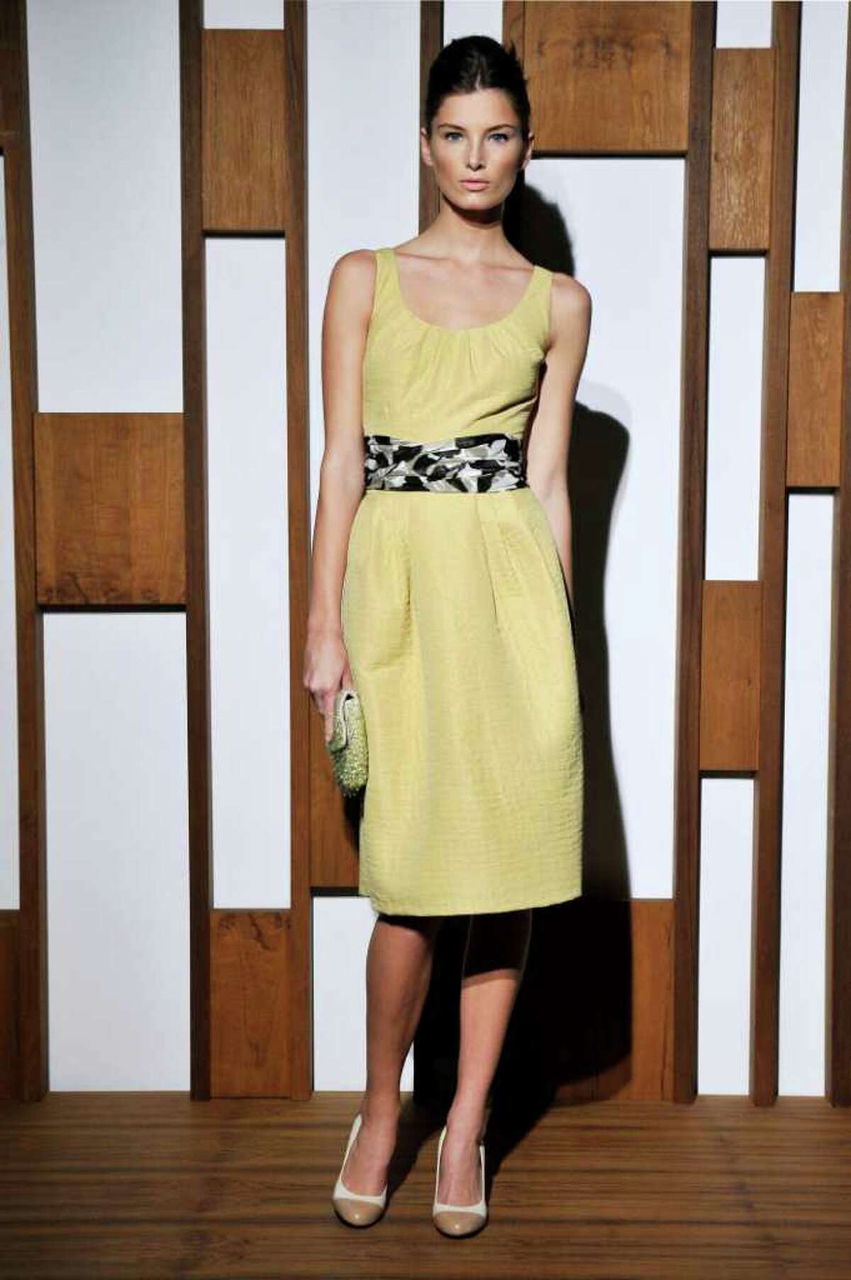 Banana Republic offers a pale yellow sheath dress for spring.