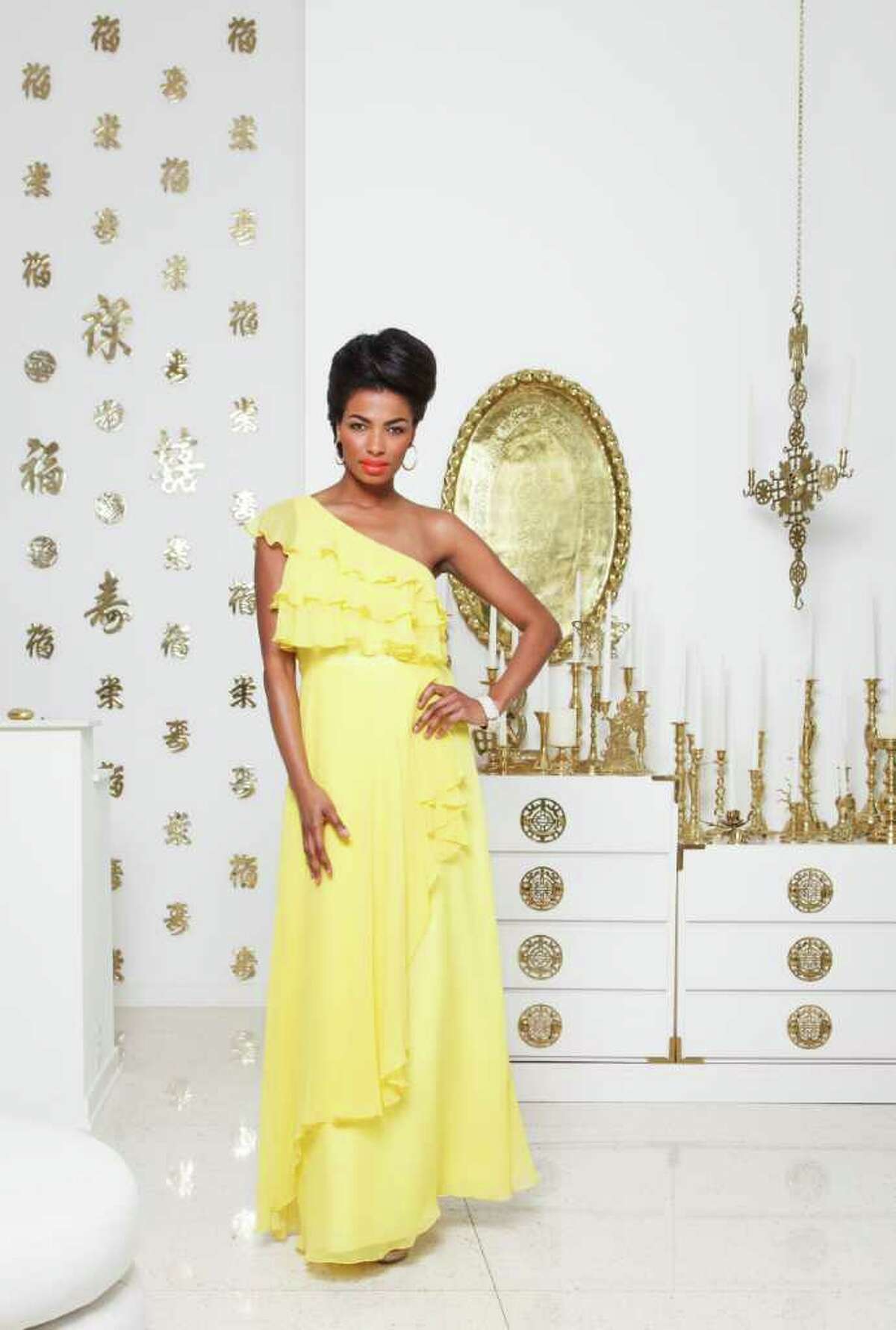 1. Clanay Wheeler of Neal Hamil Agency is wearing a yellow Jill Stuart dress, $398, with a Natasha rhinestone ring, $58, and earrings, $24; All from Dillard's. Her bracelet is Alexis Bittar, $295, from Neiman Marcus. Shoes are by Pelle Moda, $xx, Dillard's. Fashion styling by Wendy Norwood. Makeup by Tanya Robertson. Hair by Gayla Belay-Iyamu. Wednesday, Feb. 29, 2012, in Houston. ( Michael Paulsen / Houston Chronicle )