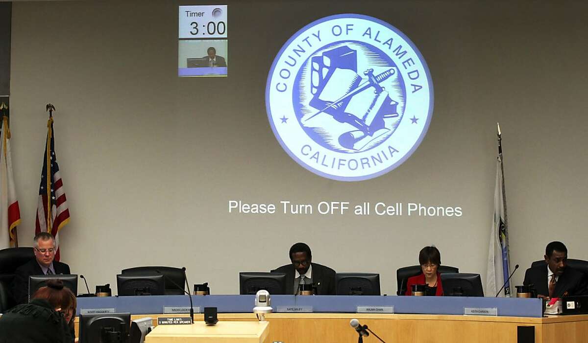 Alameda County Supervisors L to R Scott Haggerty, Nate Miley, Wilma Chan and Keith Carson conduct business without Nadia Lockyer whos seat reamins empty left, during their scheduled meeting in Oakland Tuesday March 13, 2012.