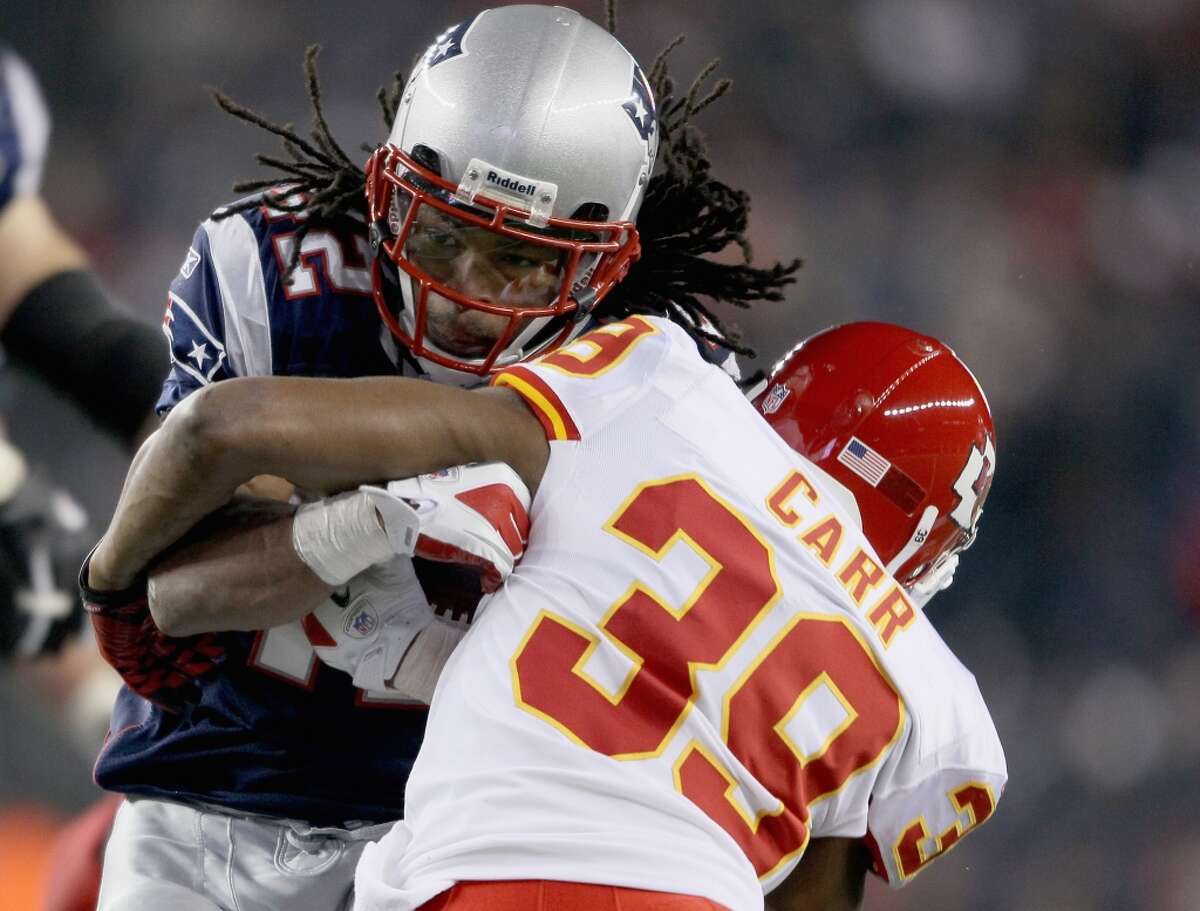 Brandon Carr of the Chiefs tackles Patriots running back BenJarvus Green-Ellis. Carr is joining the Cowboys as a free agent. Elsa/Getty Images