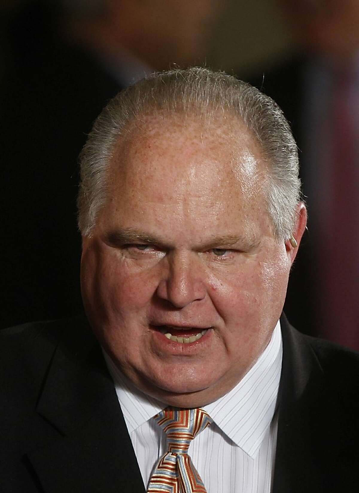 FILE - In this Jan. 13, 2009 file photo, conservative talk show host Rush Limbaugh talks with guests in the East Room of the White House in Washington. Limbaugh apologized Saturday, March 3, 2012, to a Georgetown University law student he had branded a "slut" and "prostitute" after fellow Republicans as well as Democrats criticized him and several advertisers left his program. The student, Sandra Fluke, had testified to congressional Democrats in support of their national health care policy that would compel her college to offer health plans that cover her birth control. (AP Photo/Ron Edmonds, File)