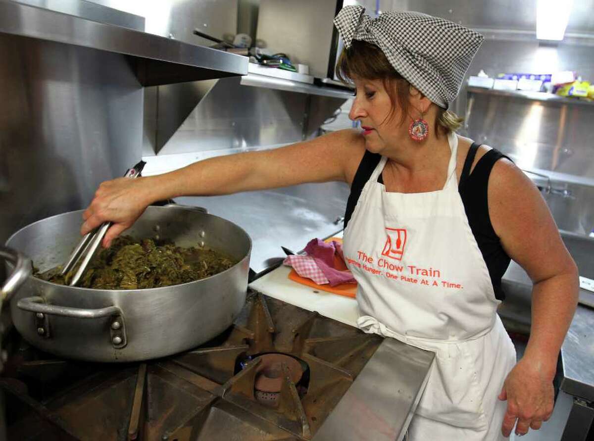Founder/chef Joan Cheever prepares braised greens with bacon before the Chow Train feeds the homeless in partnership with Resurrection Ministries.
