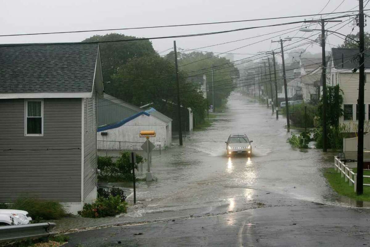A tree blocks a flooded Melba St. in Milford, Conn. on Sunday August 28, 2011.