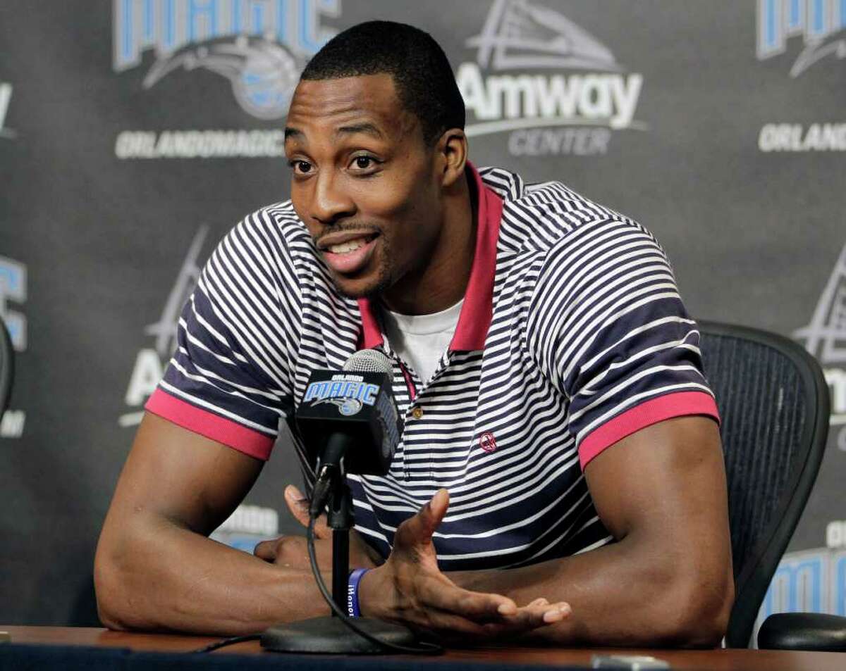 After plenty of waffling, Magic center Dwight Howard committed to stay in Orlando through the 2012-13 season.