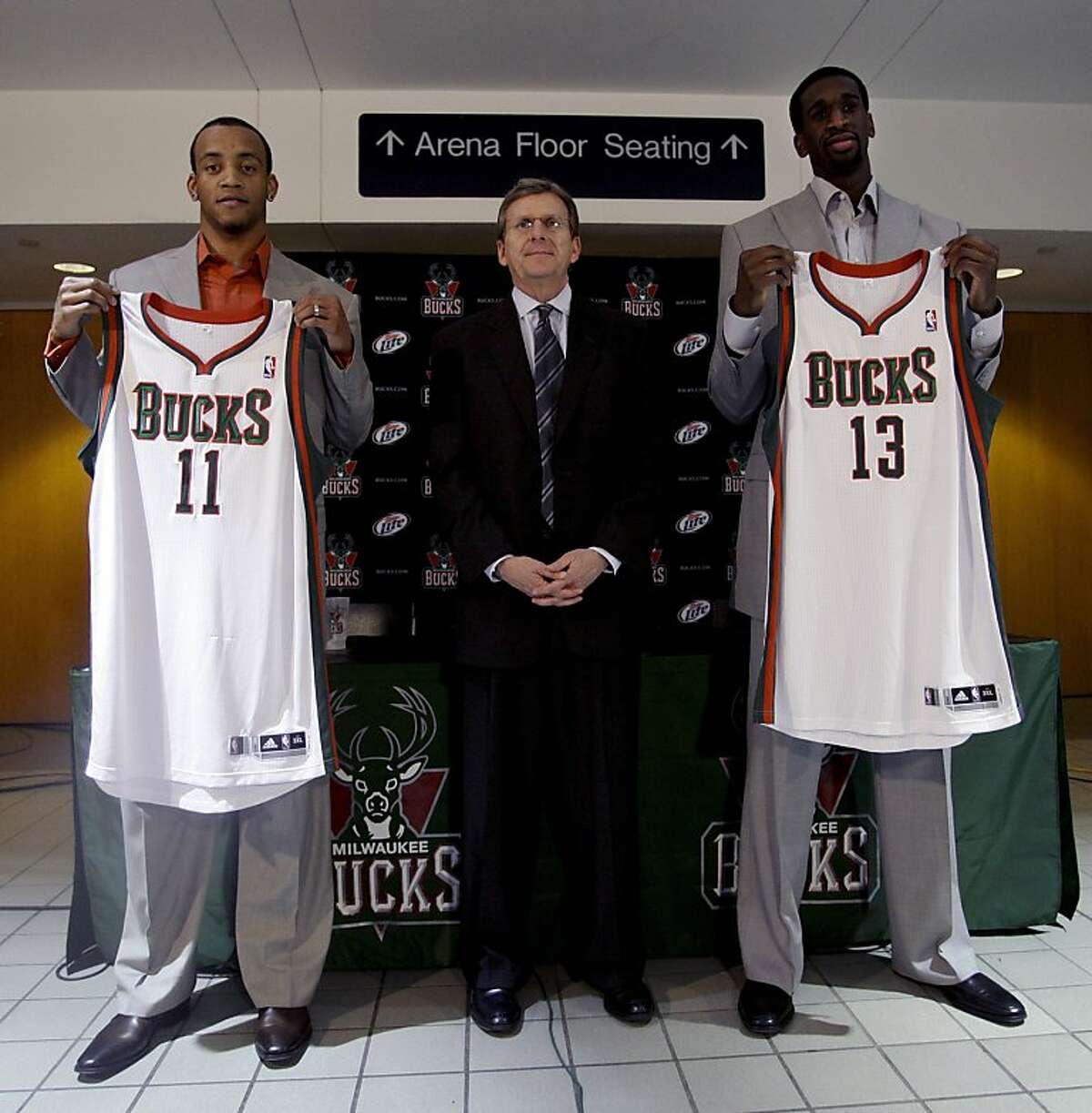 Milwaukee Bucks' Monta Ellis, left, and Ekpe Udoh, right, pose with general manager John Hammond before an NBA basketball game against the Cleveland Cavaliers on Wednesday, March 14, 2012, in Milwaukee. (AP Photo/Morry Gash)