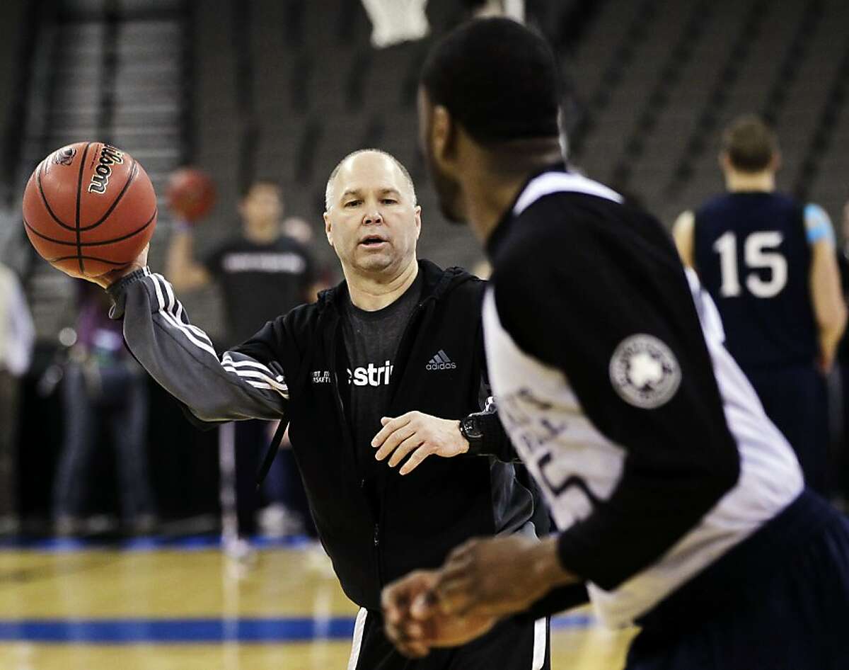 Saint Mary's coach Randy Bennett passes the ball to Tim Williams during practice at the Century Link Arena in Omaha, Neb., Thursday, March 15, 2012. Saint Mary's is scheduled to play Purdue on Friday in an NCAA second-round tournament college basketball game. (AP Photo/Nati Harnik)