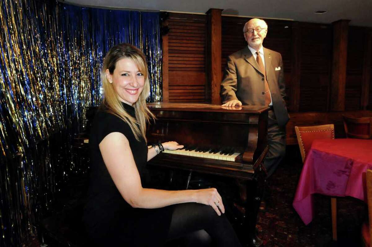 Kate Kaufman Burns, Board president, left, and Robert Harrison, chairman of Fundraising and Development, at the piano in a bar off the main theater on Tuesday, Feb. 28, 2012, at Schenectady Light Opera Company in Schenectady, N.Y. (Cindy Schultz / Times Union)