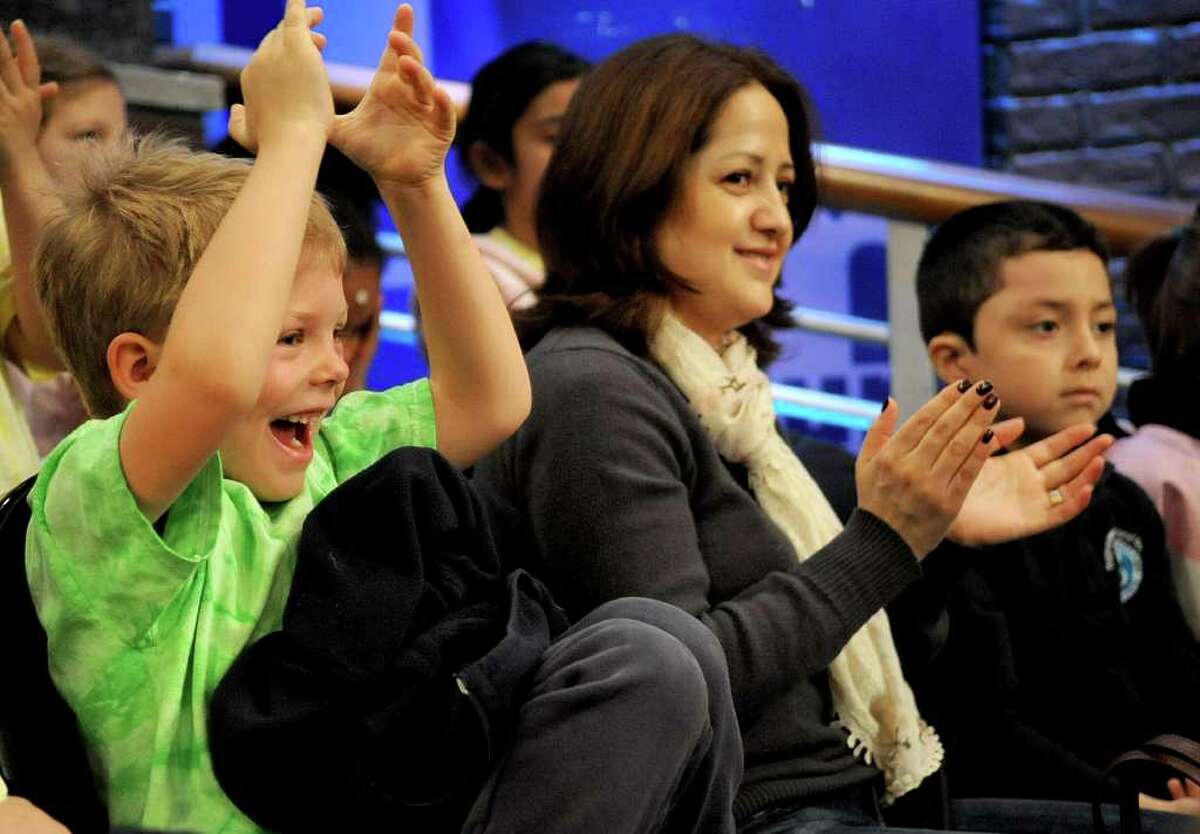 Rogers International School student Ryan Hoffman cheers for Jack Hannah during a filming of the Maury Show in Stamford on Friday, March 16, 2012.