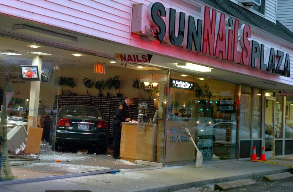 A car crashed into the Sun Nails salon in Milford, Conn. Thursday Nov. 12, 2009 injuring several people.