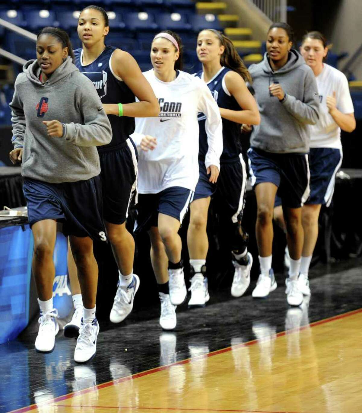 Tiffany Hayes leads the University of Connecticut women's basketball team as they run laps prior to practice Friday, March 16th, 2012 at the Webster Bank Arena, in Bridgeport, Conn. Connecticut will play Prairie View A&M in the first round of the NCAA womenâÄôs basketball tournament on Saturday.