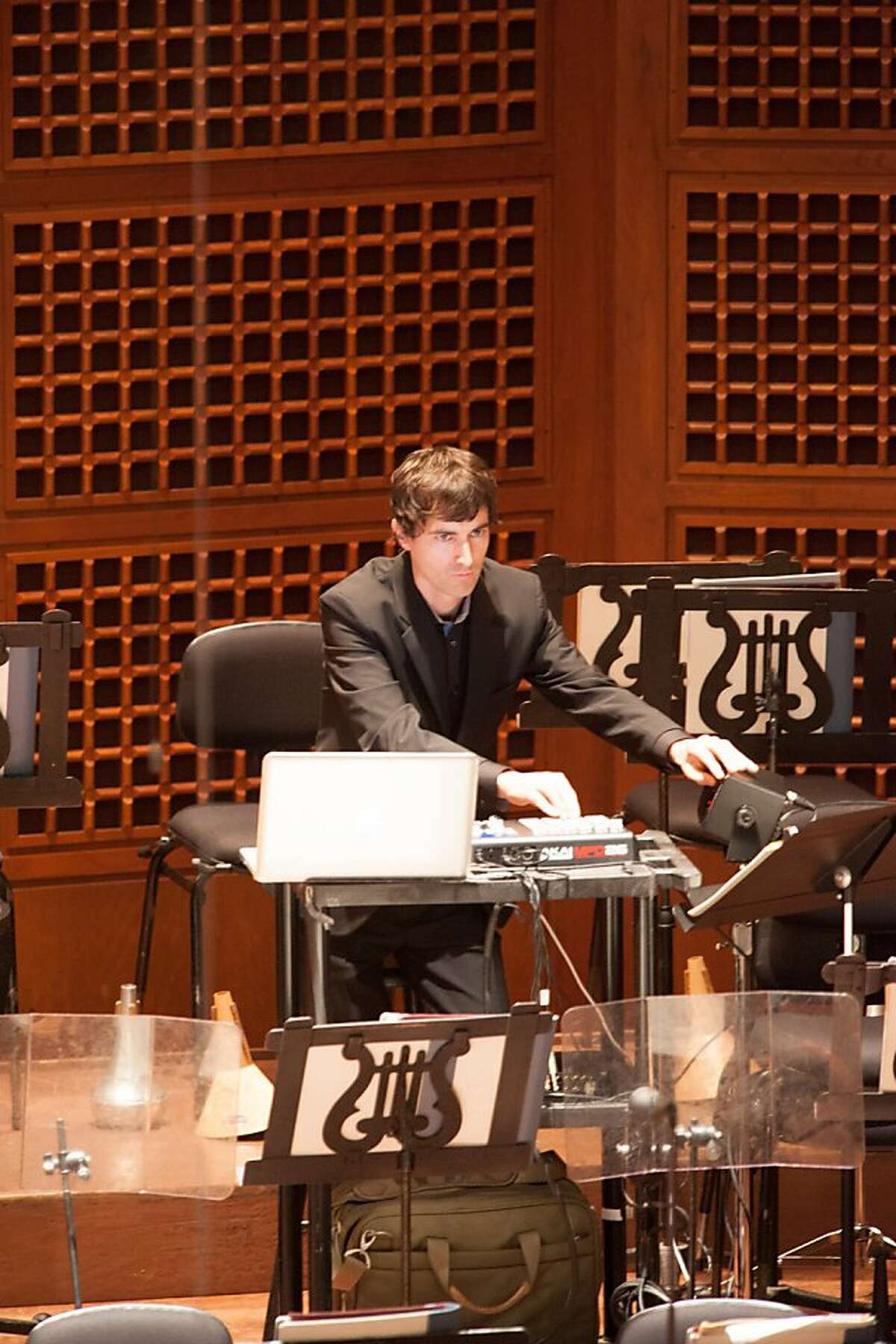 Composer Mason Bates controlling the electronica in the premiere of his "Mass Transmission" 3/15/12
