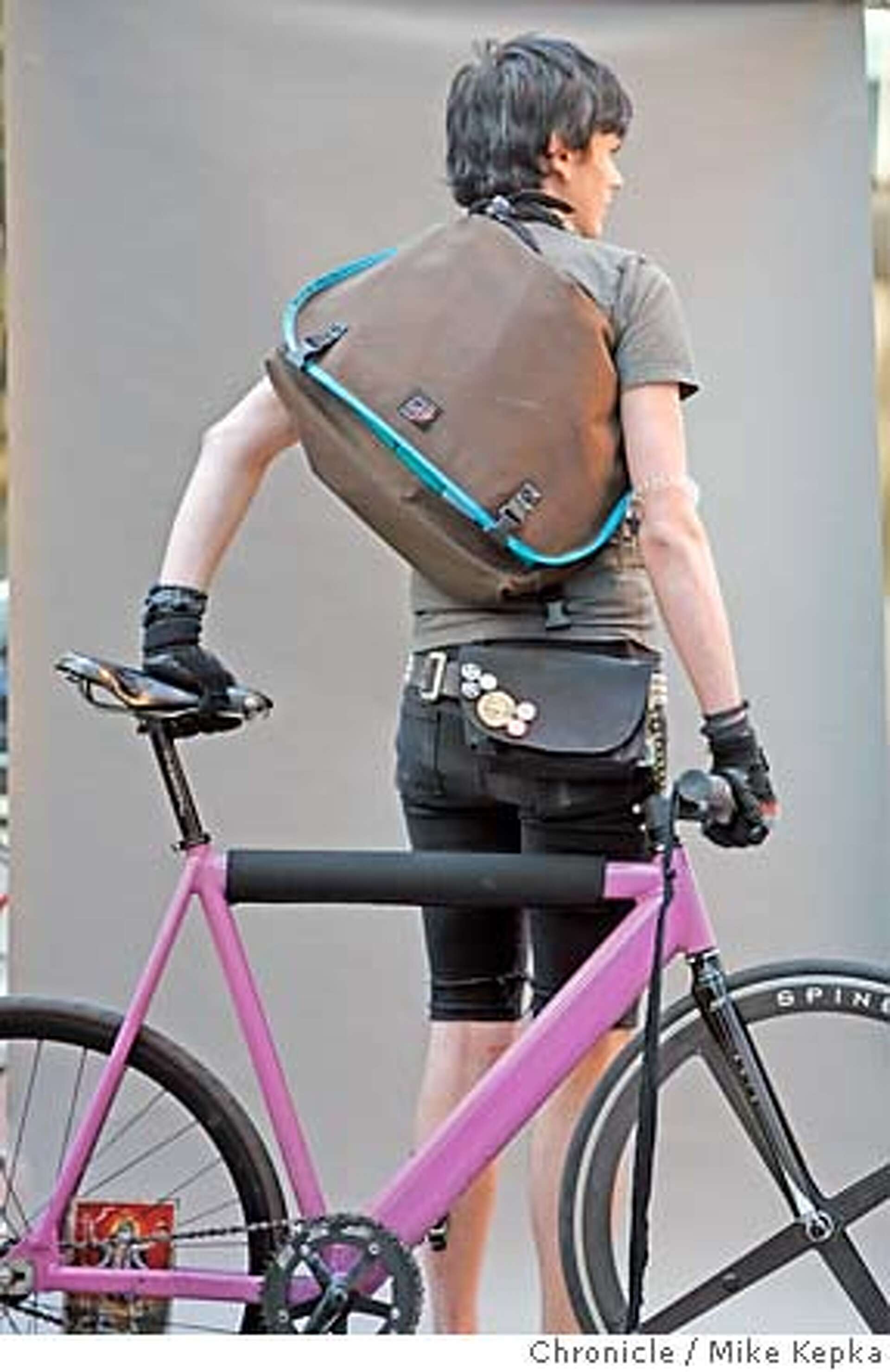 CRITICAL CLASS Bike messengers sport cool clothes as they wend their way through city streets