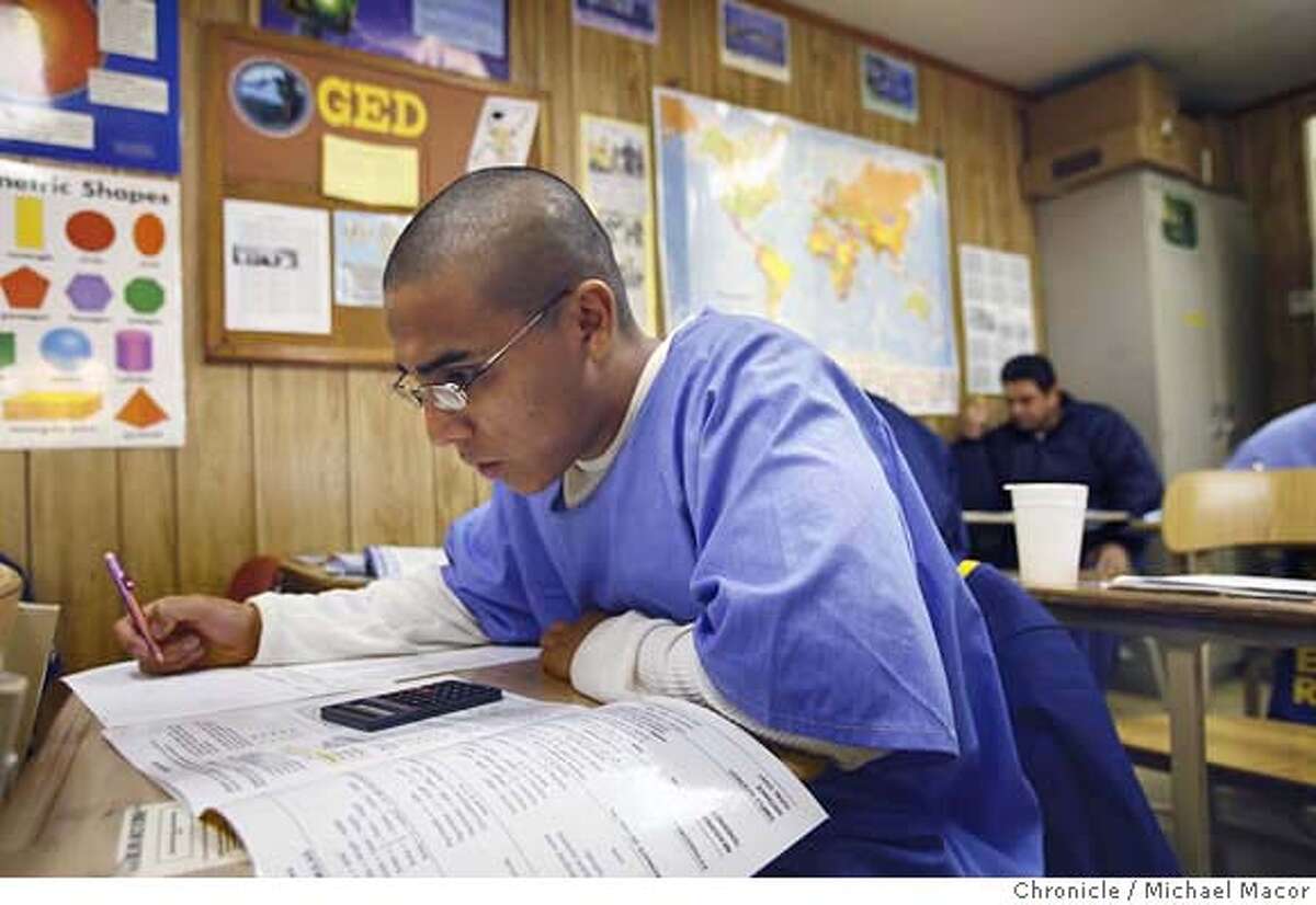 prisoneducation_024_mac.jpg Inmate Gabriel Velasquez is taking his pre GED math class, Velasquez is enrolled in the AB-2 (Adult Basic Education) class. AB-2 is the upper level course. CRC-California Rehabilitation Center in Norco, Ca. Nearly everyone agrees that the best way to address the overcrowding in California's prisons is to reduce the soaring recidivism rate, and that one of the best ways to get the rate down is to arm the more than 100,00 inmates who are functionally illiterate with a solid education. Educations programs in the prisons are badly underfunded and serve few of the inmates needing help. Too few classrooms,long waiting lists for getting into remedial programs. Event in, Norco, Ca, on 12/20/06. Photo by: Michael Macor/ San Francisco Chronicle Mandatory credit for Photographer and San Francisco Chronicle / Magazines Out