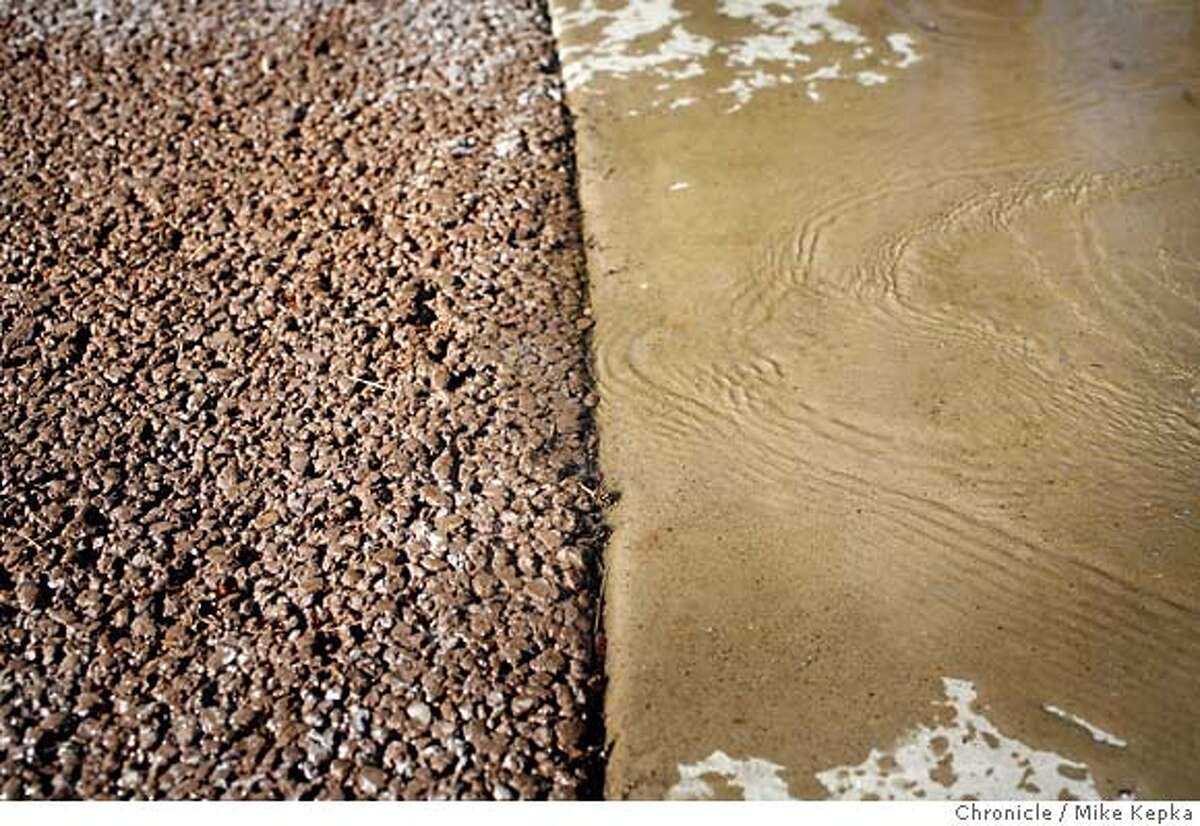 When it rains, it's porous / Concreteslab driveways may soon be a