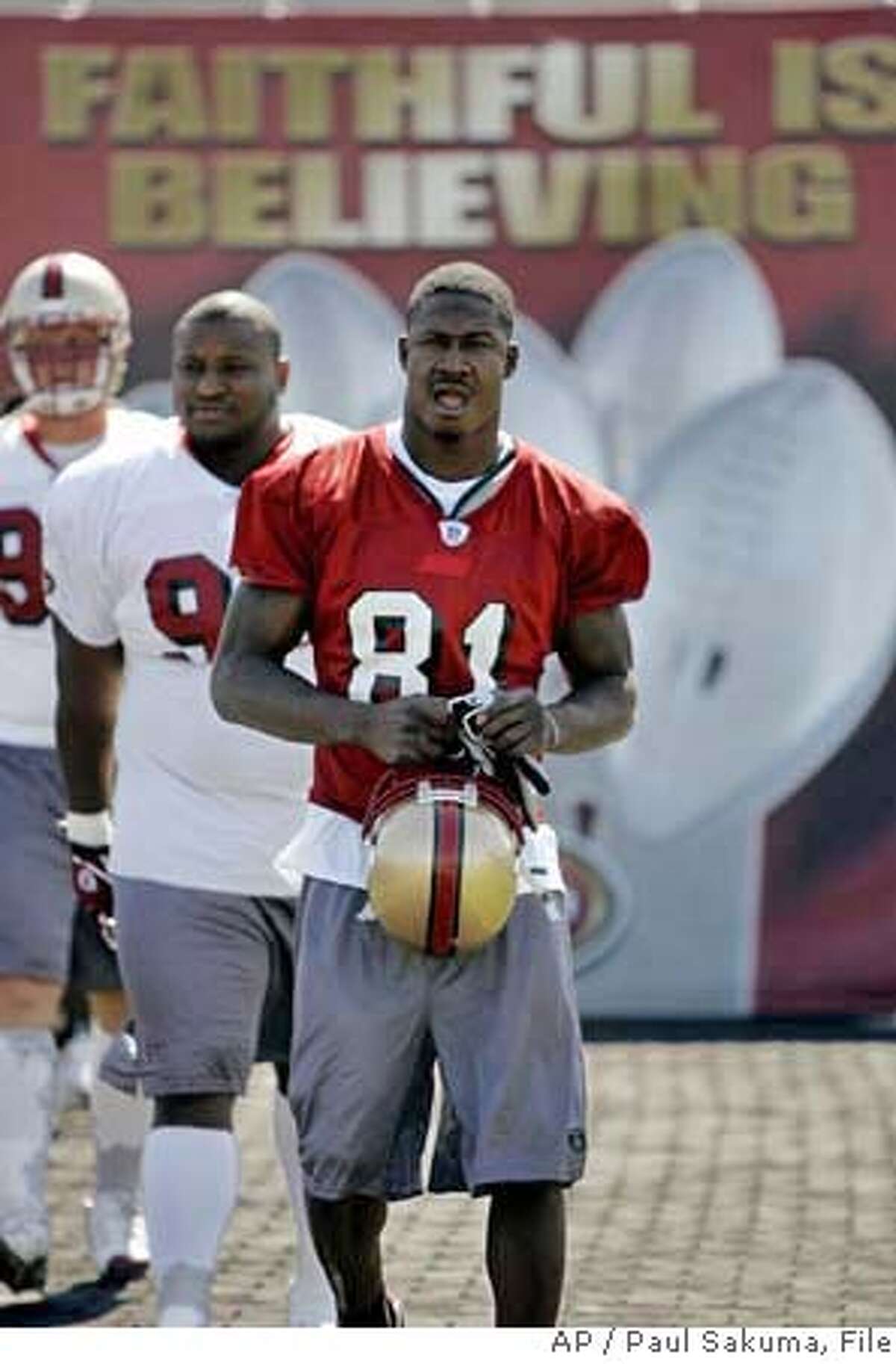 ** FILE ** San Francisco 49ers wide receiver Antonio Bryant (81) arrives at football training camp in Santa Clara, Calif., in a July 28, 2006, file photo. Bryant was suspended for four games Friday, Dec. 22, 2006, for violating the NFL's substance abuse policy, dealing a blow to the 49ers' faint playoff hopes. (AP Photo/Paul Sakuma) JULY 28, 2006, FILE PHOTO EFE OUT