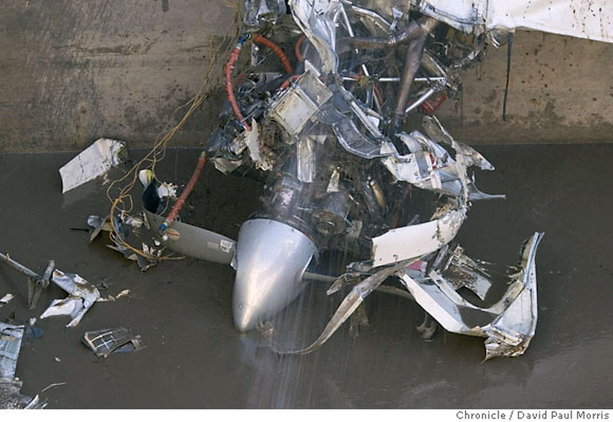 GILROY, CA- DECEMBER 19: One of the props lies at the bottom of a sewage tank as workers work to clean up the debris of a twin-engine Beechcraft Travel Air after it crashed into a tank of raw sewage at the South County Regional Wastewater Authority treatment plant in on December 18, 2006 in Gilroy, California. On board the plane was the flight instructor, Shoki Haraguchi and the passengers, Yoshiyuki Kato and Yasushi Miyata, who had come to the United States to learn how to fly. (Photo by David Paul Morris/The Chronicle)