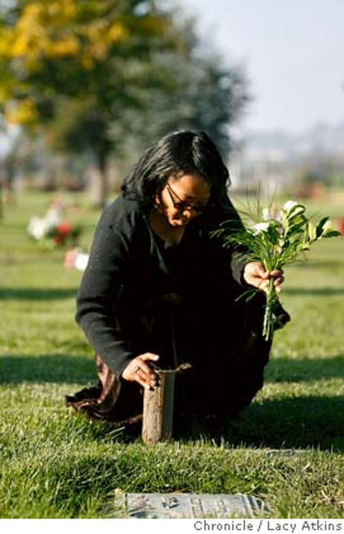 Lorrain Taylor visits her sons grave at the Chapel of the Chimes Memorial Park, Sunday Dec. 3, 2006, in Hayward, Ca. Because they are buried here, she remains in the bay area rather than near her other living son, Gregory, in Houston. Her twin sons Albade and Obadiah were killed in February of 2000. (Lacy Atkins / The Chronicle)